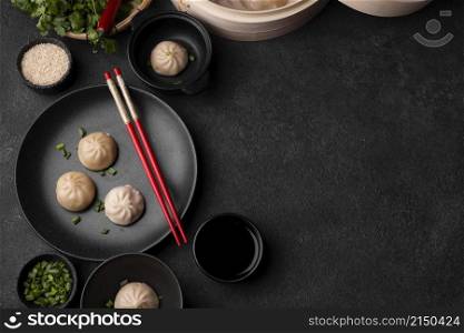 top view asian dumplings with chopsticks copy space