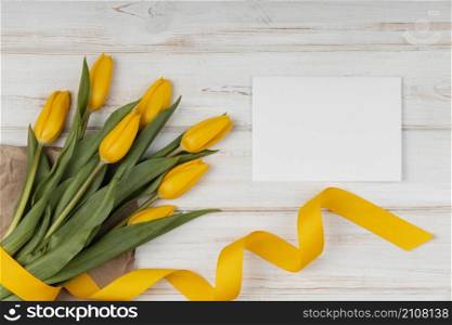 top view assortment yellow tulips with empty card