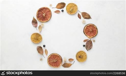 top view autumn leaves with dried citrus