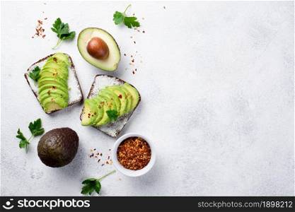 top view avocado toast breakfast with herbs spices. Resolution and high quality beautiful photo. top view avocado toast breakfast with herbs spices. High quality beautiful photo concept