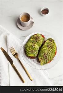 top view avocado toast plate with cutlery coffee