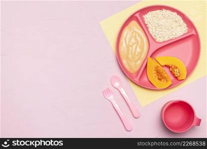 top view baby food with fruit cutlery