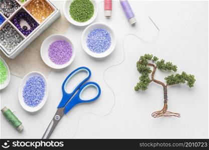 top view bead working essentials with scissors tree