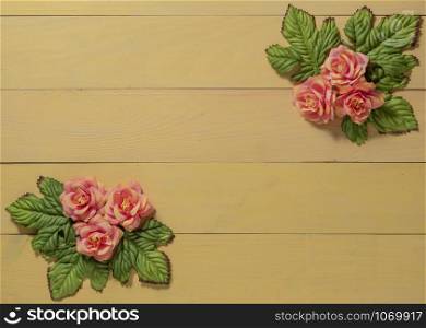 top view beautiful flowers with leaves on wooden background. top view beautiful flowers with leaves