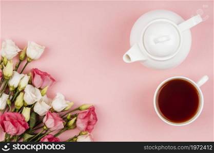 top view beautiful roses arrangement with teapot cup tea. High resolution photo. top view beautiful roses arrangement with teapot cup tea. High quality photo