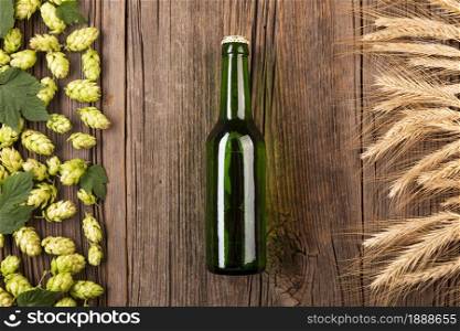 top view beer bottle with ingredients. Resolution and high quality beautiful photo. top view beer bottle with ingredients. High quality and resolution beautiful photo concept