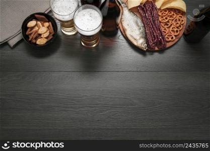 top view beer glass bottle with food platter with copy space