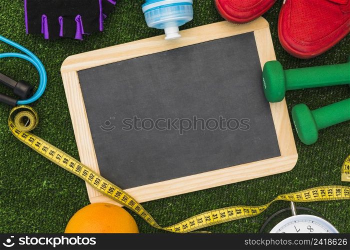 top view blank slate surrounded with sports equipment turf