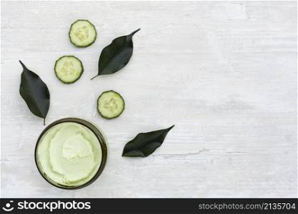 top view body butter cucumber wooden table