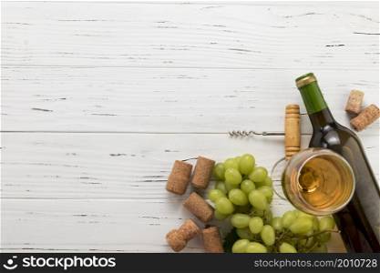 top view bottle wine with glass bunch grapes
