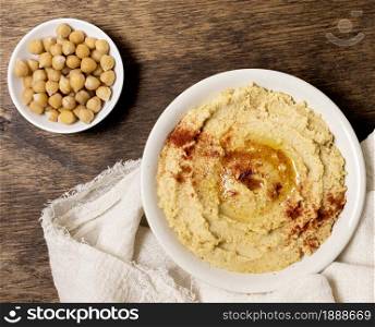 top view bowl hummus with chickpeas. Resolution and high quality beautiful photo. top view bowl hummus with chickpeas. High quality and resolution beautiful photo concept