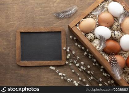 top view box with eggs easter blackboard