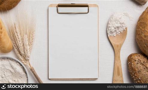 top view breads mix with blank clipboard flour. Resolution and high quality beautiful photo. top view breads mix with blank clipboard flour. High quality and resolution beautiful photo concept