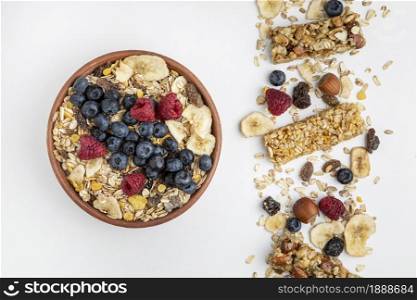 top view breakfast cereal bars with fruits bowl. Resolution and high quality beautiful photo. top view breakfast cereal bars with fruits bowl. High quality and resolution beautiful photo concept