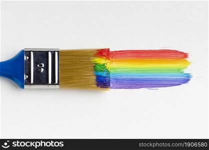 top view brush with rainbow paint. High resolution photo. top view brush with rainbow paint. High quality photo