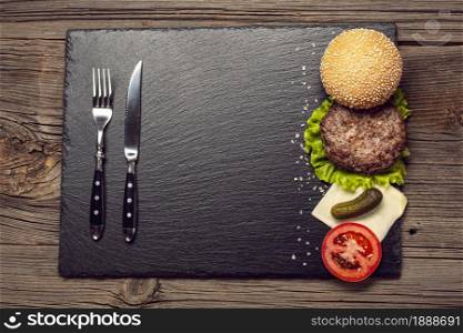 top view burger ingredients slate board. Resolution and high quality beautiful photo. top view burger ingredients slate board. High quality and resolution beautiful photo concept