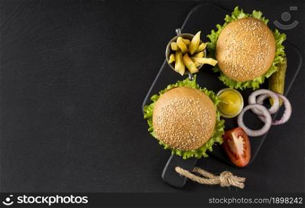 top view burgers fries with pickles copy space. Resolution and high quality beautiful photo. top view burgers fries with pickles copy space. High quality beautiful photo concept