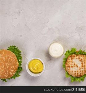 top view burgers with mayo mustard dip