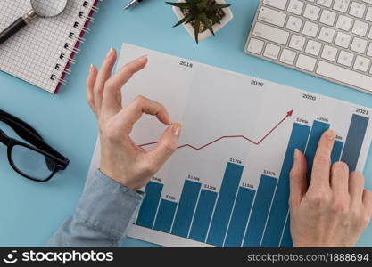 top view business items with growth chart hands giving okay sign. Resolution and high quality beautiful photo. top view business items with growth chart hands giving okay sign. High quality and resolution beautiful photo concept