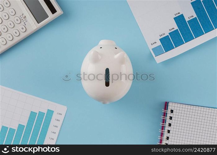 top view business items with piggy bank growth chart