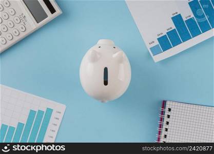 top view business items with piggy bank growth chart