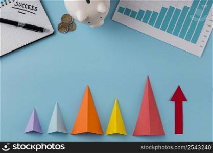 top view business items with piggy bank growth cones