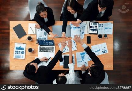 Top-view business team of financial data analysis meeting with business intelligence, report paper and dashboard on laptop for marketing strategy. Business people working together in office of harmony. Business team of financial data analysis meeting report paper in harmony office.