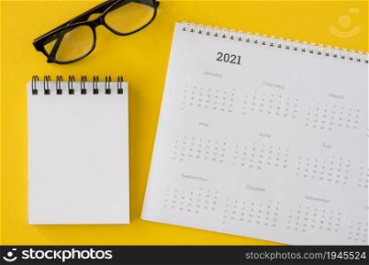top view calendar with notepad glasses. High resolution photo. top view calendar with notepad glasses. High quality photo
