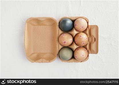 top view carton with easter eggs