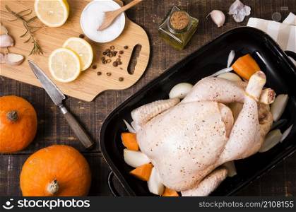 top view chicken pan with lemon slices thanksgiving