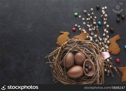 top view chocolate easter eggs nest with candy copy space. Resolution and high quality beautiful photo. top view chocolate easter eggs nest with candy copy space. High quality beautiful photo concept