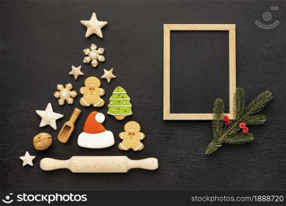 top view christmas gingerbread cookies assortment with empty frame. Resolution and high quality beautiful photo. top view christmas gingerbread cookies assortment with empty frame. High quality and resolution beautiful photo concept