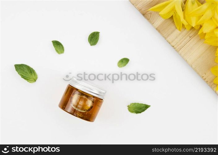 top view close up shot jar honey with flowers leaves