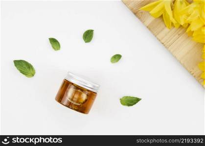 top view close up shot jar honey with flowers leaves