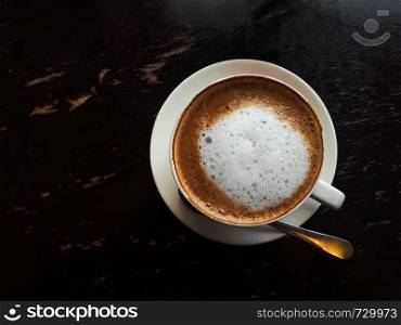 Top view coffee cup on wooden table in cafe