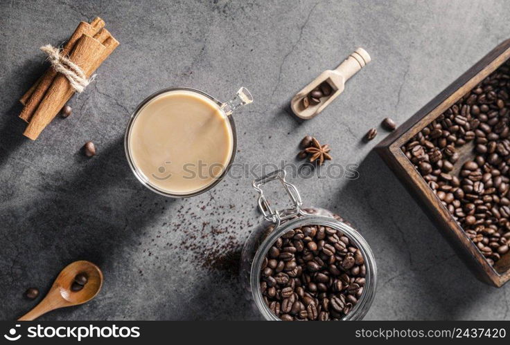 top view coffee cup with cinnamon sticks jar