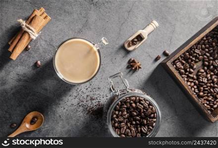 top view coffee cup with cinnamon sticks jar