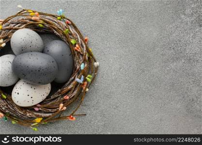 top view colored easter eggs basket with copy space