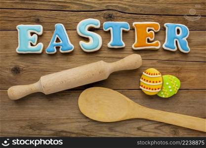 top view colorful easter eggs with rolling pin wooden spoon