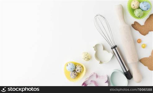 top view colorful eggs kitchen utensils with copy space