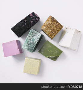 top view colorful soap bars white backdrop