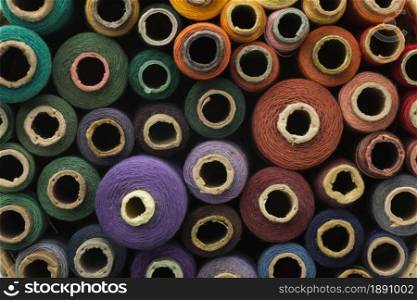 top view colourful sewing threads background. Resolution and high quality beautiful photo. top view colourful sewing threads background. High quality and resolution beautiful photo concept