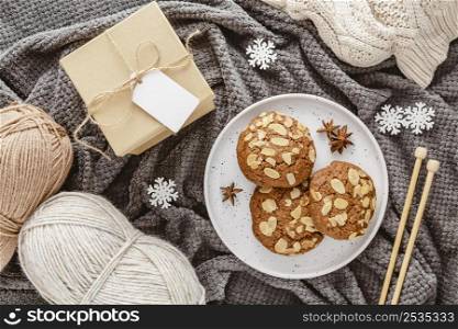top view cookies yarn gift box blanket