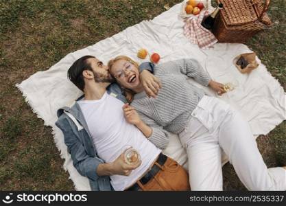top view couple having picnic together