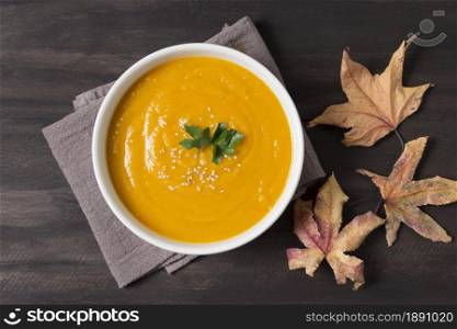 top view cream soup and autumn leaves. Resolution and high quality beautiful photo. top view cream soup and autumn leaves. High quality and resolution beautiful photo concept