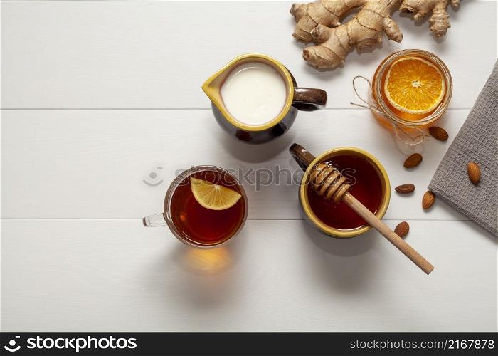 top view cup tea with honey orange slice