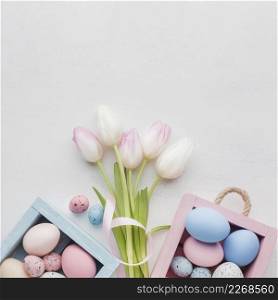 top view cute boxes with colorful easter eggs bouquet tulips