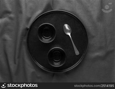 top view dark plate with spoon
