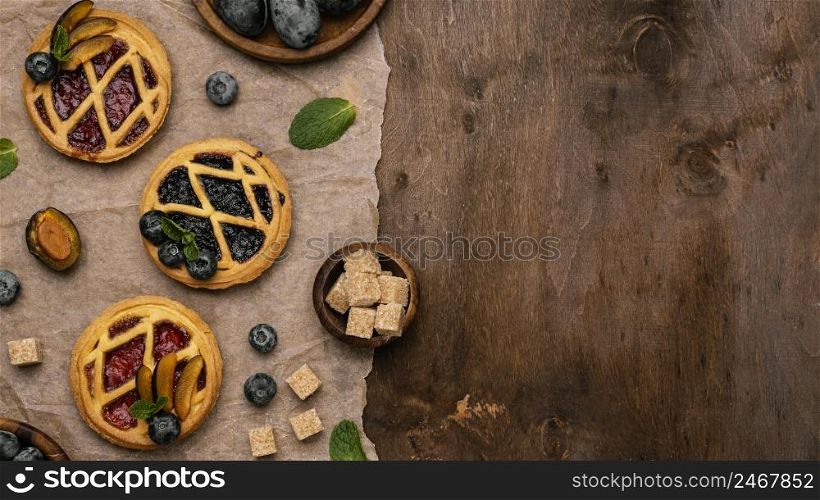 top view delicious fruit pies with plums copy space 2