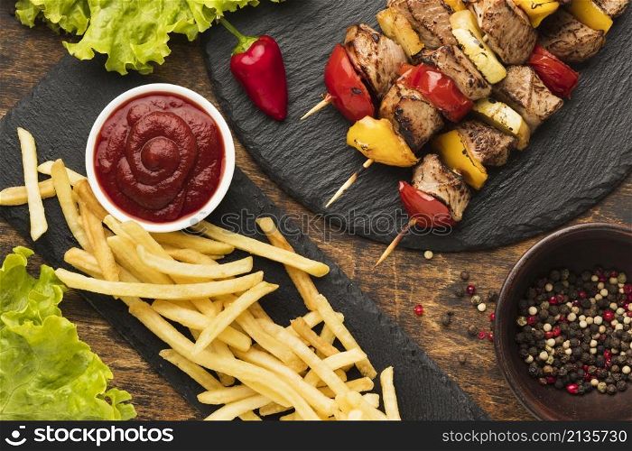 top view delicious kebab with french fries ketchup